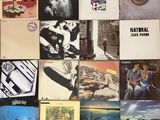 a lot of different album covers on the wall
