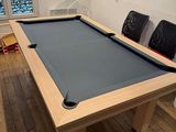 a pool table in the middle of a living room