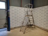 a ladder that is standing in front of a wall
