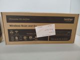 a box with a sticker on it that says wireless scan and get