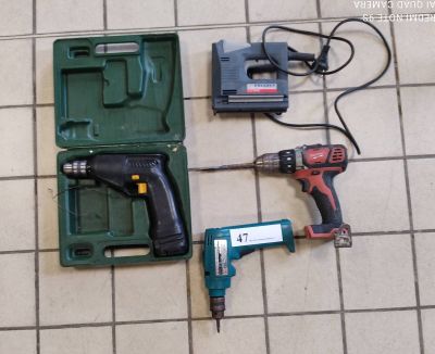 two tools that are laying on the floor next to each other