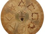 a wooden clock that has a lot of symbols on it