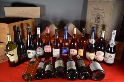 many bottles of wine sitting on a table with a red table cloth