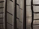 a close up of a tire on a wooden surface