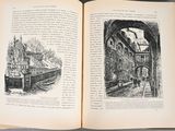 an open book with a picture of a building in it