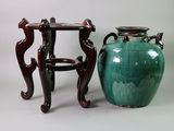 two vases sitting next to each other on a table