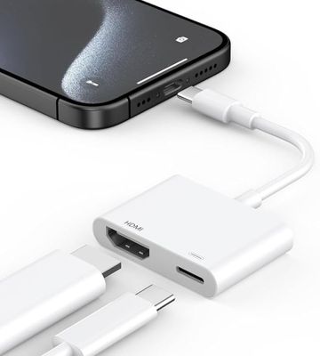 an image of a close up of a cell phone with a charger attached to it