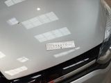 a picture of a car with a sticker on it ' s hood