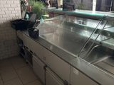 an image of a restaurant kitchen with a counter and a counter top