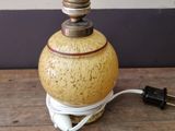 a small lamp that is on a wooden table