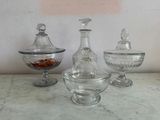 three glass containers sitting on a marble counter top