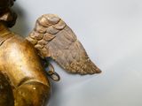 a statue of an angel with a bird on it ' s shoulder