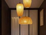 three lamps hanging over a table in a room