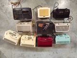 a lot of old radio ' s that are on the floor