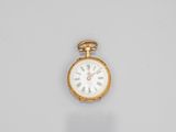 a close up of a gold pocket watch with roman numerals on the face