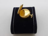 an image of a gold plated pocket watch on a velvet case