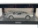 a silver model of a car in a box