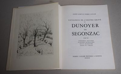 an open book with a drawing of a snowy landscape