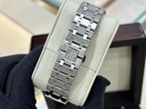 a person holding a watch that is in a box