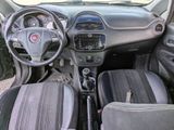 dashboard of a small car with a steering wheel and dashboard controls