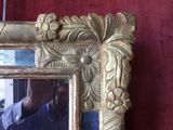 a man taking a picture of himself in a mirror