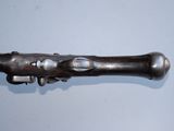 a metal object that looks like a gun on a table