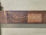 a piece of wood that has a plaque on it