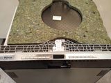 a dishwasher that has a moss on top of it