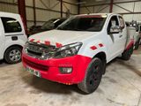 a picture of a white and red truck parked in a garage