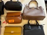 a lot of purses that are on a table