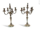 pair of silver plated candelabs with candlesticks on stands