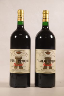two bottles of chateau pradau wine sitting next to each other