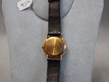 a watch on display on a mannequin with a price tag on it