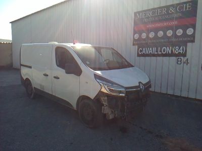 a white van parked in front of a building
