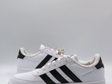 a white and black adidas sneakers on a white background