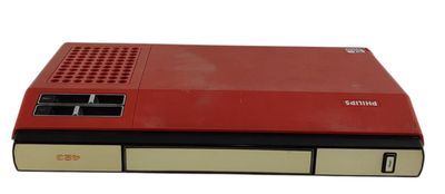 une image représentant une console de jeux Nintendo rouge posée sur une surface blanche
