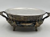an antique silverplated bowl with handles and handles on a stand