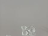 a close up of a glass vase filled with flowers on top of a table