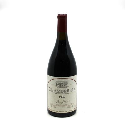 a bottle of wine that is sitting on a table