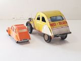 two toy cars that are sitting next to each other