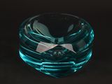 a glass bowl with a bow on top of it