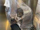 a machine that is wrapped in plastic and sitting on a counter