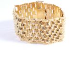 an image of a gold bracelet on a white background