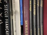 many books that are on a book shelf together