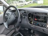 dashboard of a car with a steering wheel and dashboard controls