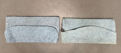 two pieces of felt are sitting on a table next to each other