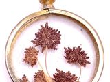 a picture of a picture of a tree inside of a pendant