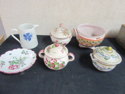 many different types of dishes and cups on the table