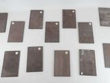 several pieces of metal sitting on top of a table next to each other