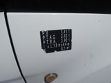 a close up of a car door with a sticker on it